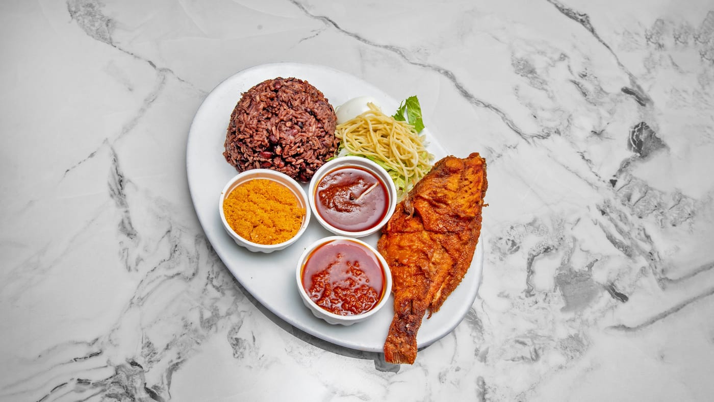 Grilled tilapia with waakye or jollof