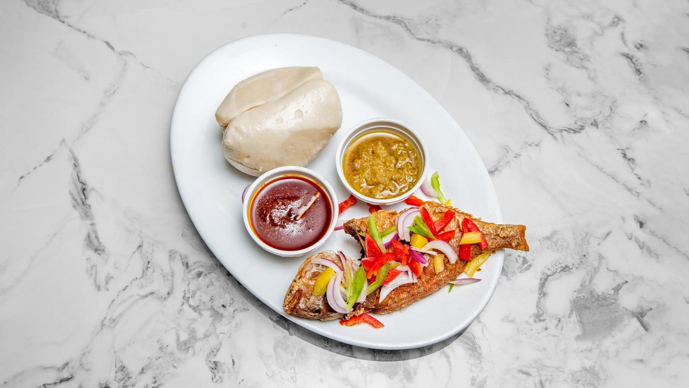 Grilled tilapia with banku, kenkey, fried yam or plantain